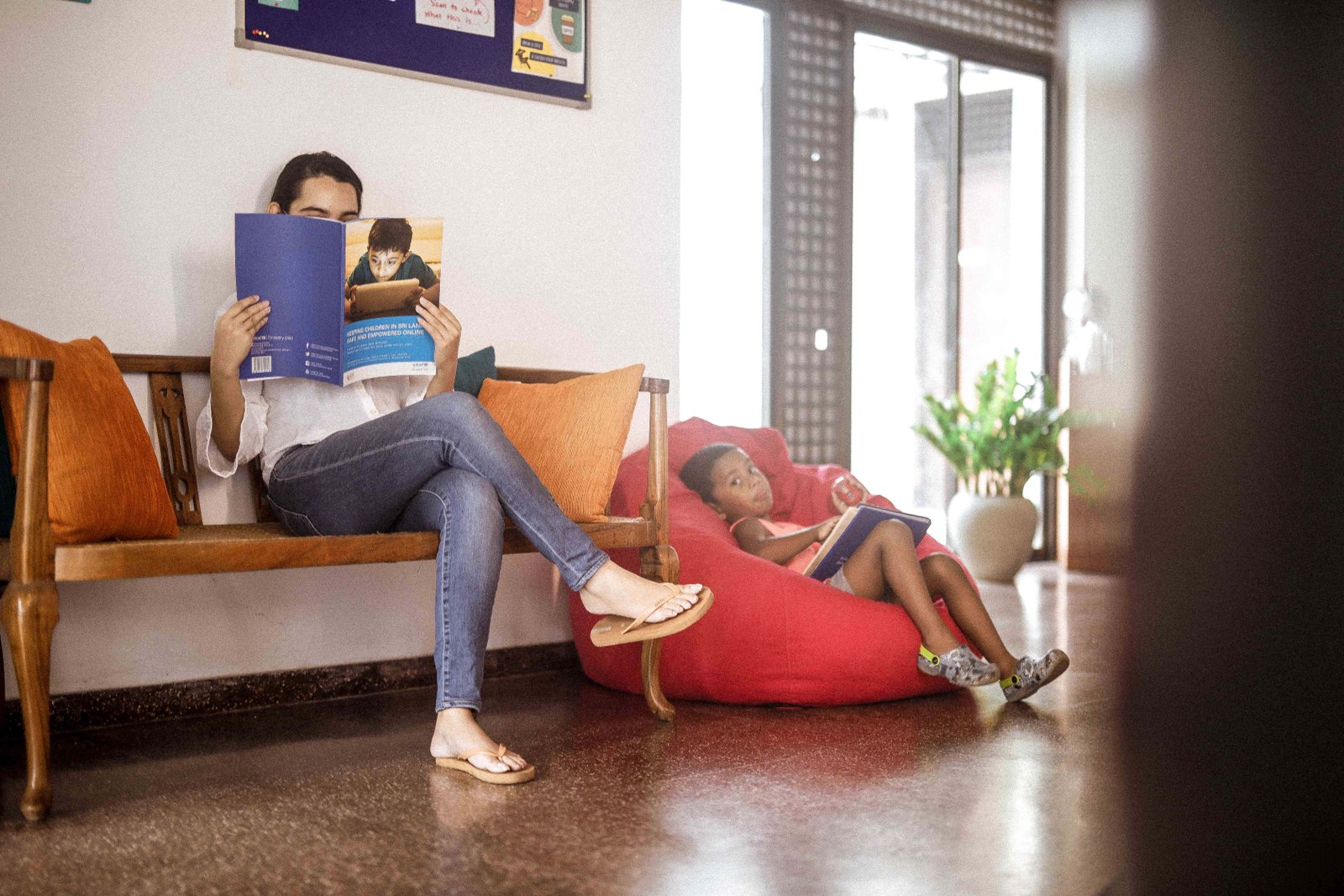 Woman and child reading at CAFS