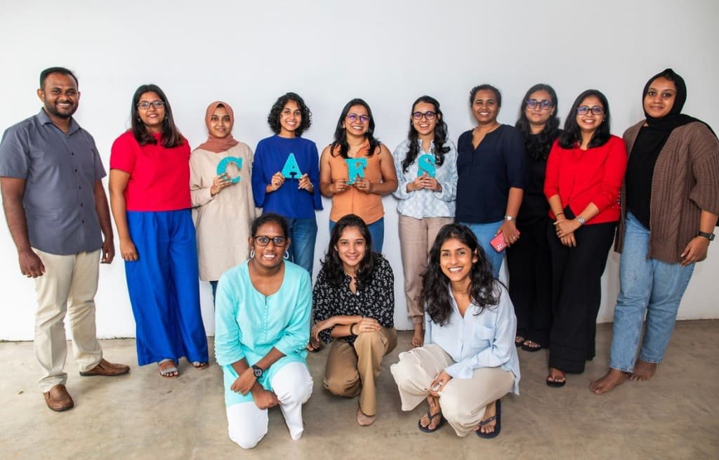 The CAFS team holding letters spelling CAFS